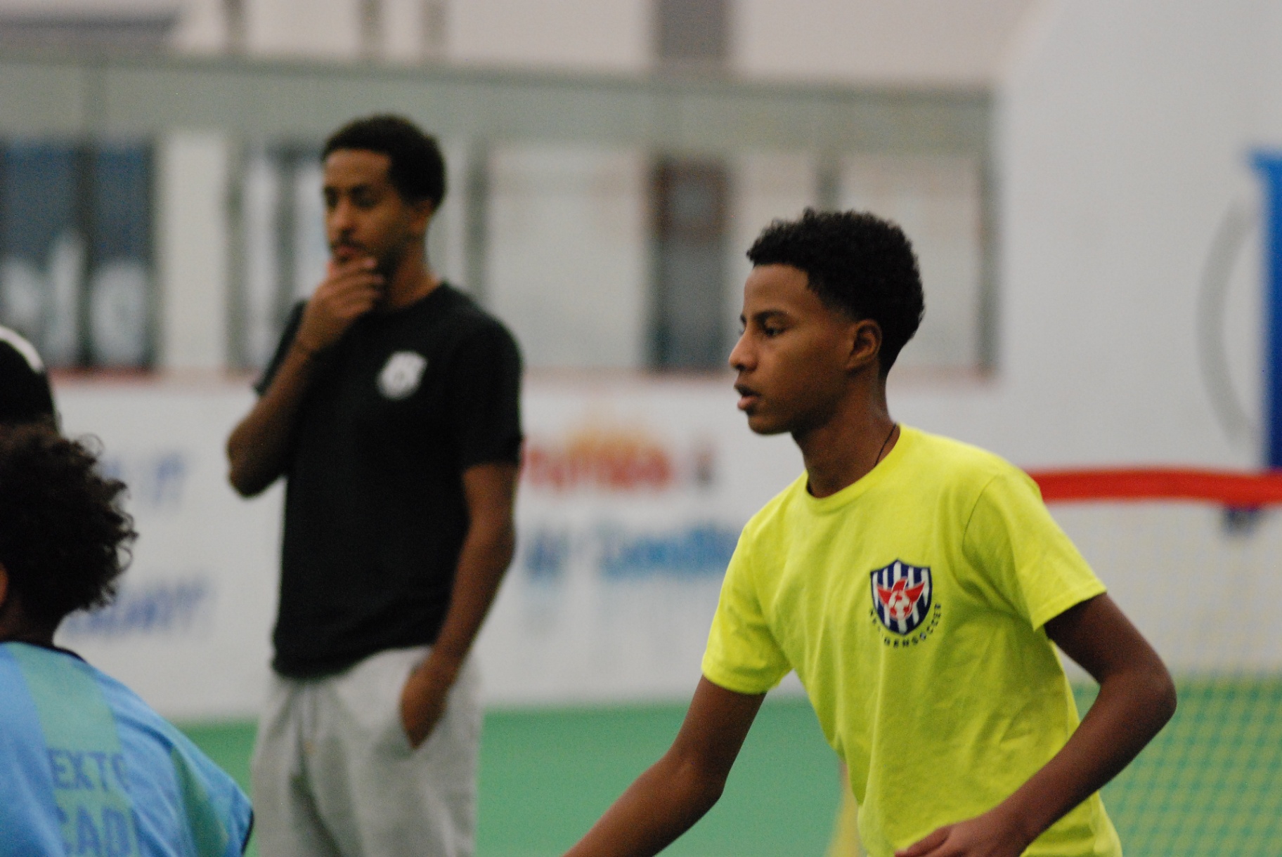 Coach and player on the field